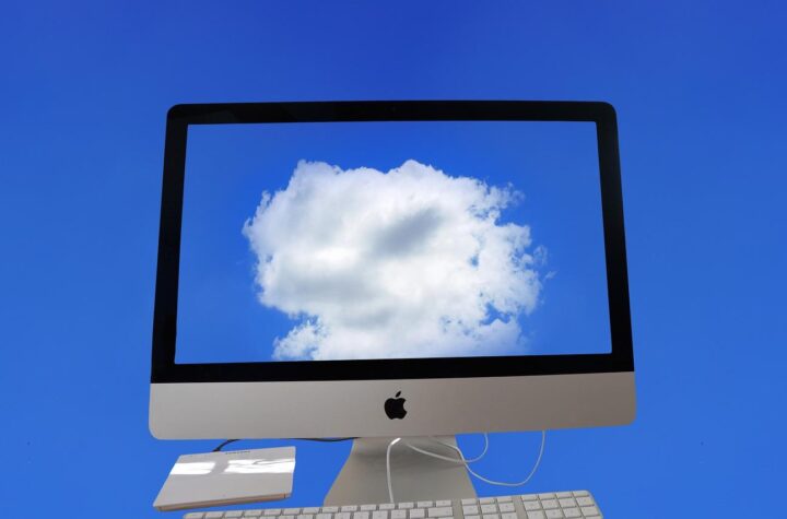 A computer with a cloud on the screenAI-generated content may be incorrect.